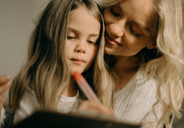 girl writing on the paper photograph 3171118